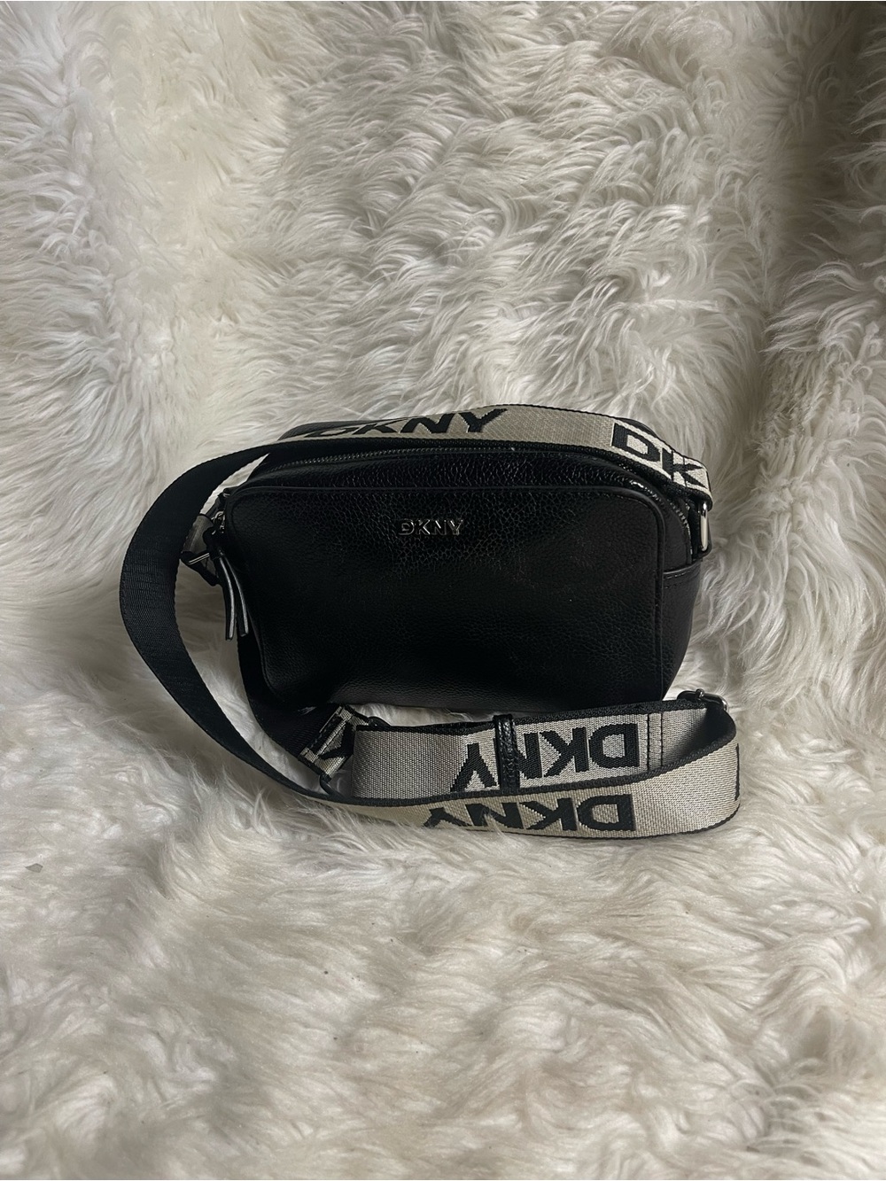 DKNY Black Belt Bag in pebble black synthetic leather black &white logo strap